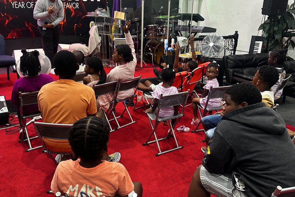 Children seated for a lesson during Vacation Bible School